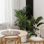 Close up of dining table near window and green plants in pots, home interior, 3d rendering