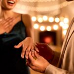 Close Up Of Loving Couple Celebrating Engagement At Party Together