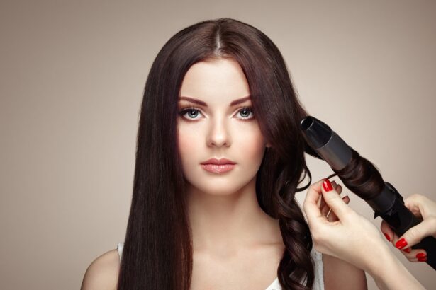 Hairdresser woman curls her hair