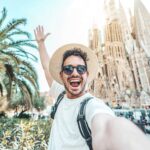 Happy tourist visiting La Sagrada Familia, Barcelona Spain