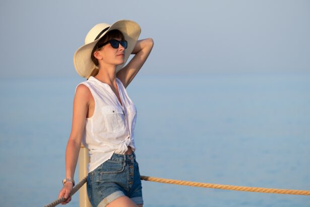 Young woman in casual outfit relaxing on seaside on warm summer day